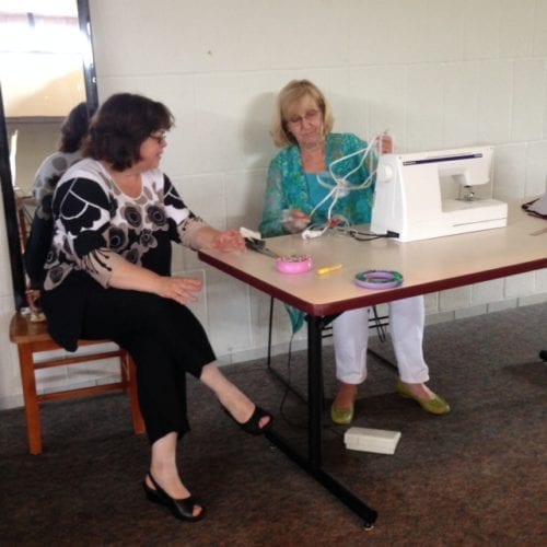 Rae conferring with Jane at a pattern testing event in 2014.