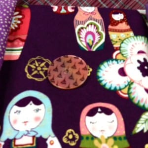 Testing the button on the doll fabric. 