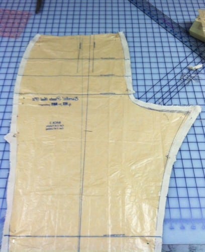 Pants pieces with extra seam allowance under the pattern.