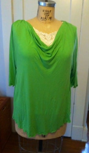 Green draped tee with curved hemline.