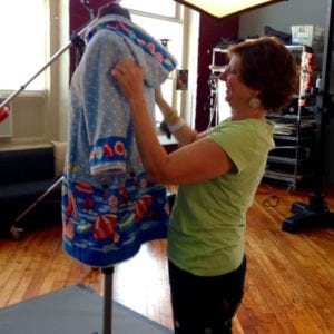 Our friend and stylist Edye adjusting the beach coat.