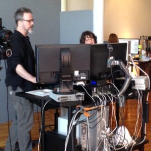 Photographer Brion and Rae checking the computer monitors.