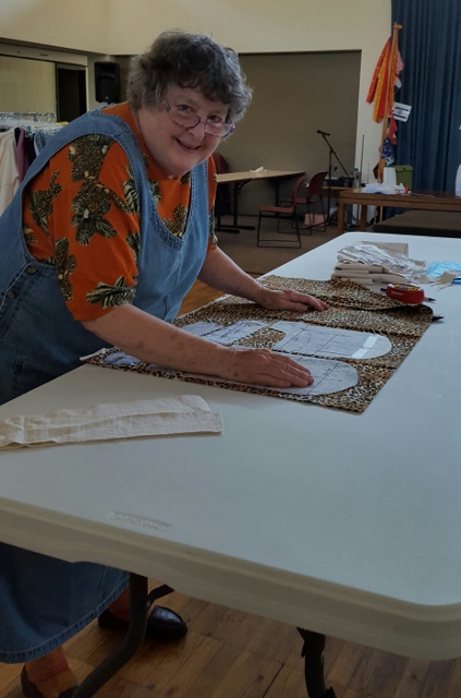 Cutting the pocket linings for her tan zoo pants.