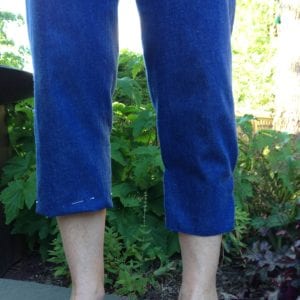 Capris with 1" hem on right leg and pegging on left. 